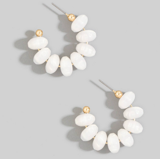 White chunky oval resin beaded hoop earrings with small gold-tone accents and post-back closures.