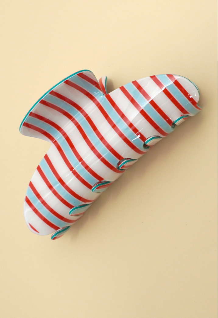 Jumbo red, blue and white striped hair claw clip with glossy curved design.