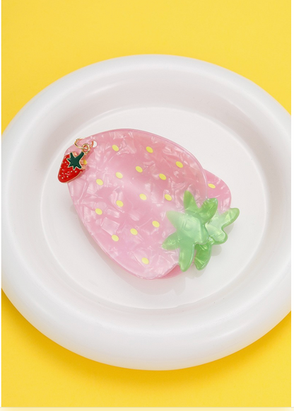 Fruit Salad Strawberry hair claw clip in pearly pink with yellow seed details, green leaves and a dangling strawberry charm.