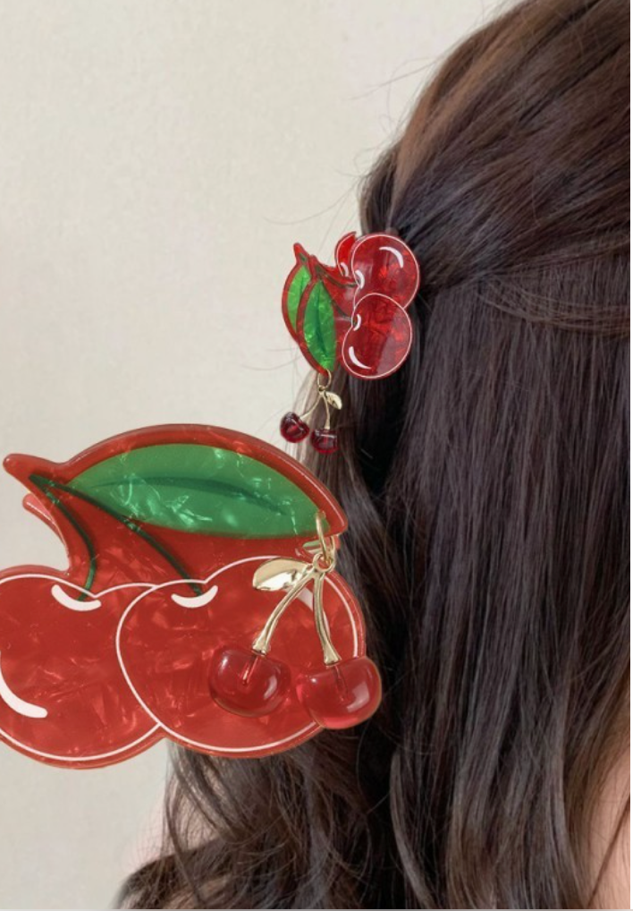 Fruit Salad Cherry hair claw clip with glossy red cherries, green leaves and tiny dangling cherry charms.