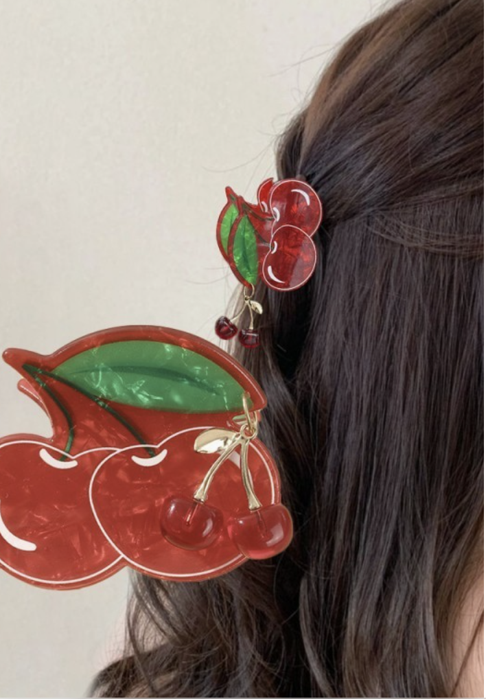Fruit Salad Cherry hair claw clip with glossy red cherries, green leaves and tiny dangling cherry charms.
