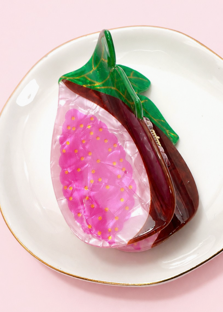 Zesty Claw Clip Fig featuring a glossy marbled pink fig design with burgundy edges, golden seed details and green leaves.