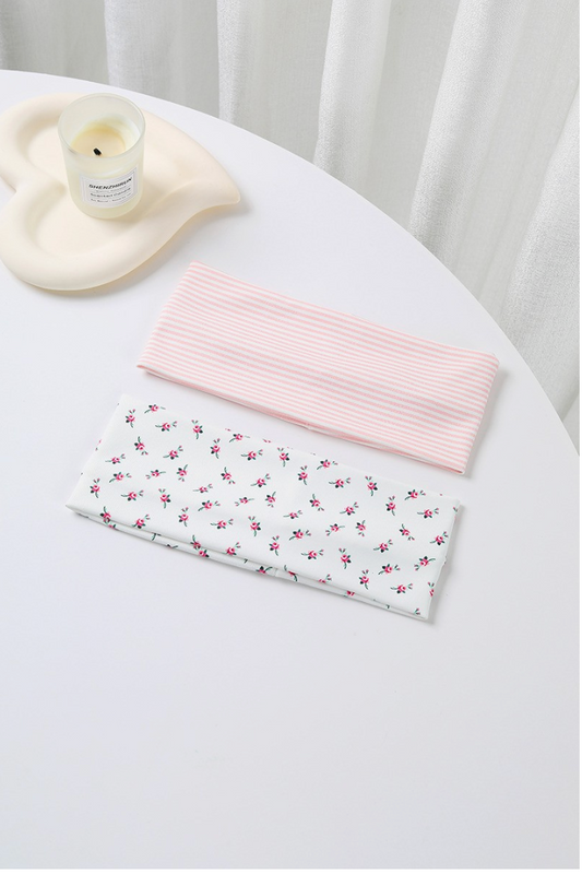 Dreaming Of Pinstripe Headband Set featuring a white rosebud floral headband and pastel pink striped wide headband.