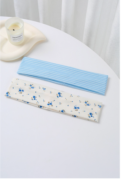 My Loyalty Floral Headband Set featuring a sky blue and white striped headband and cream headband with delicate French blue floral print.
