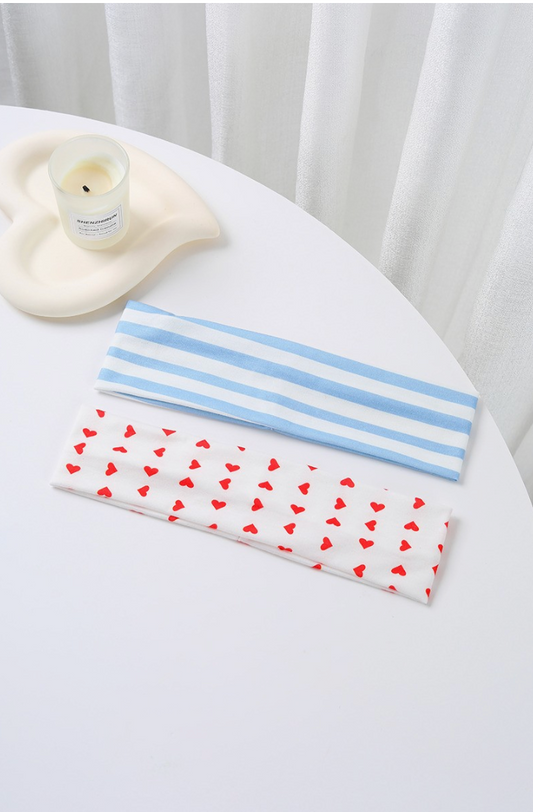 Mixed Feelings Striped Headband Set featuring a dusty blue and white striped headband and white headband with red heart print.
