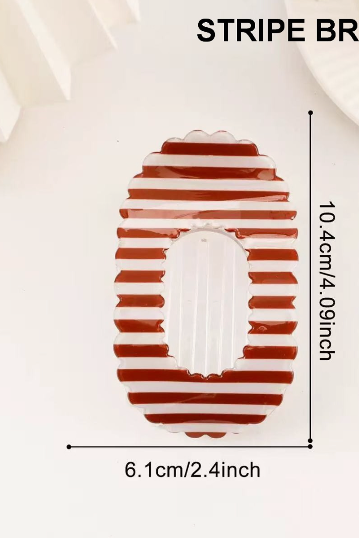 Lift You Up Claw Clip Brown featuring an oversized flat hair claw with brown and white stripes and scalloped edges.