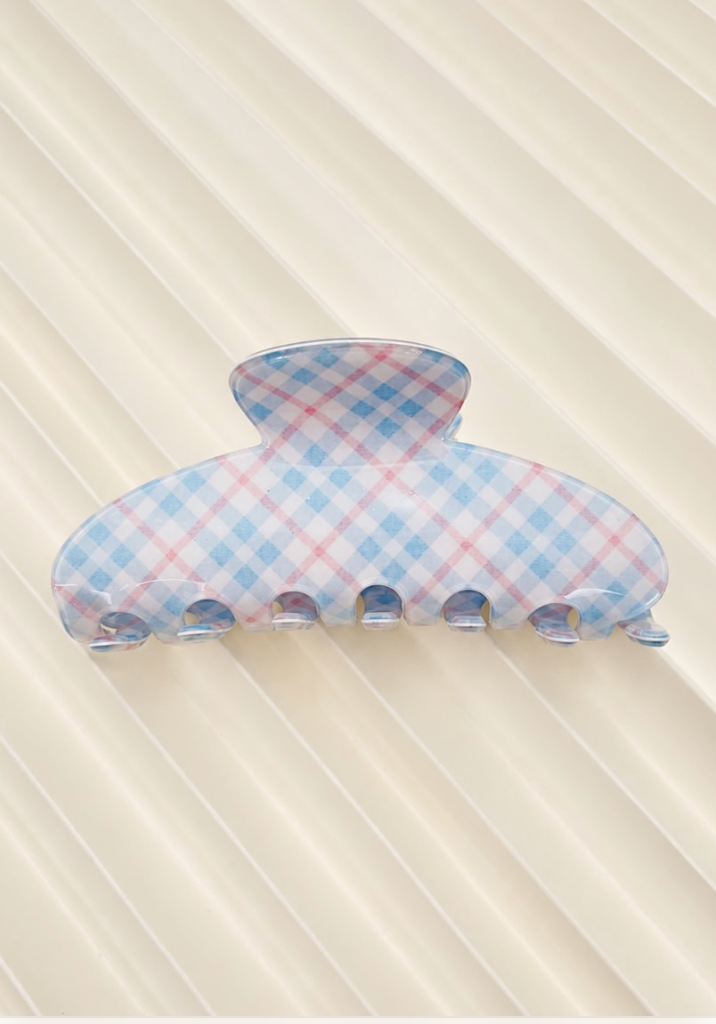 Kelsey Plaid Claw Clip Blue featuring a rounded blue plaid hair claw with interlocking teeth.