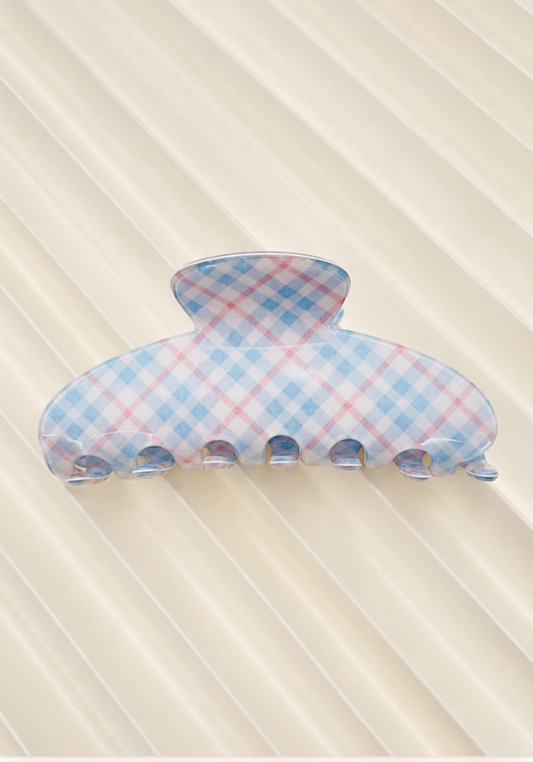 Kelsey Plaid Claw Clip Blue featuring a rounded blue plaid hair claw with interlocking teeth.