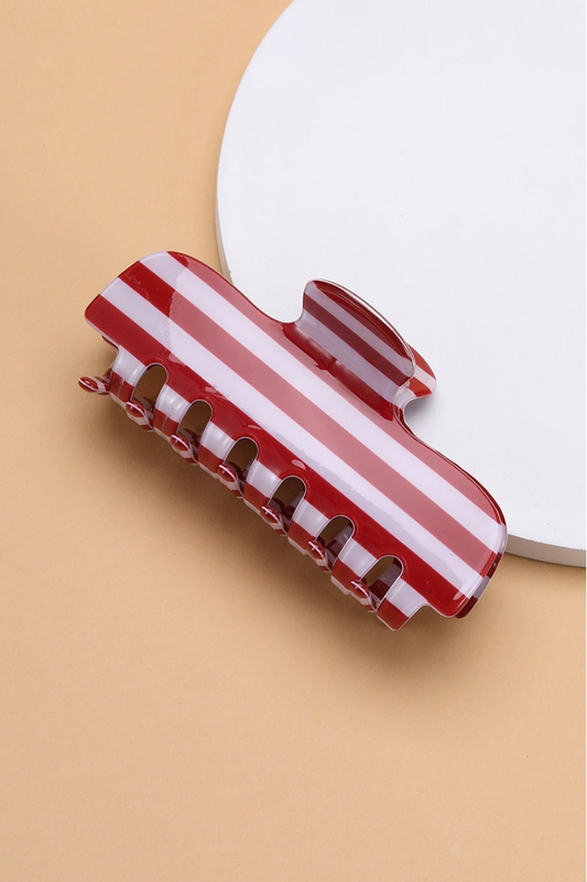 Father Figure Striped Claw Clip Red featuring a glossy red and white striped acetate hair claw with interlocking teeth.