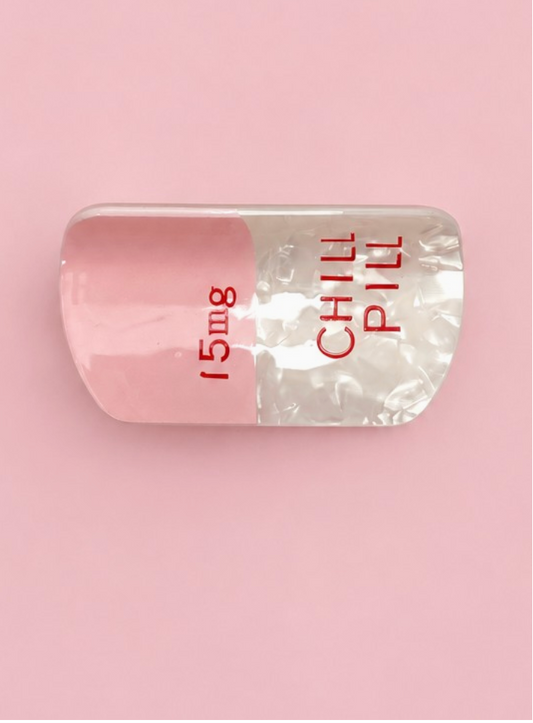 Chill Pill Claw Clip Pink novelty pink and pearlescent white pill-shaped hair clip with red lettering