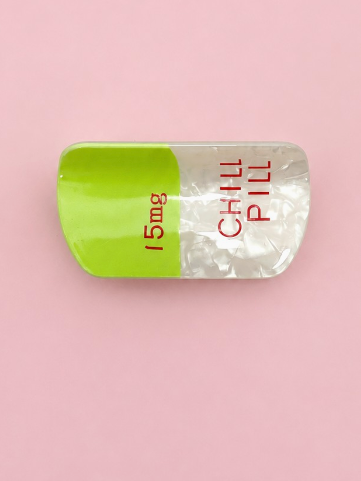 Chill Pill Claw Clip Lime novelty lime green and pearlescent white pill-shaped hair clip with red lettering