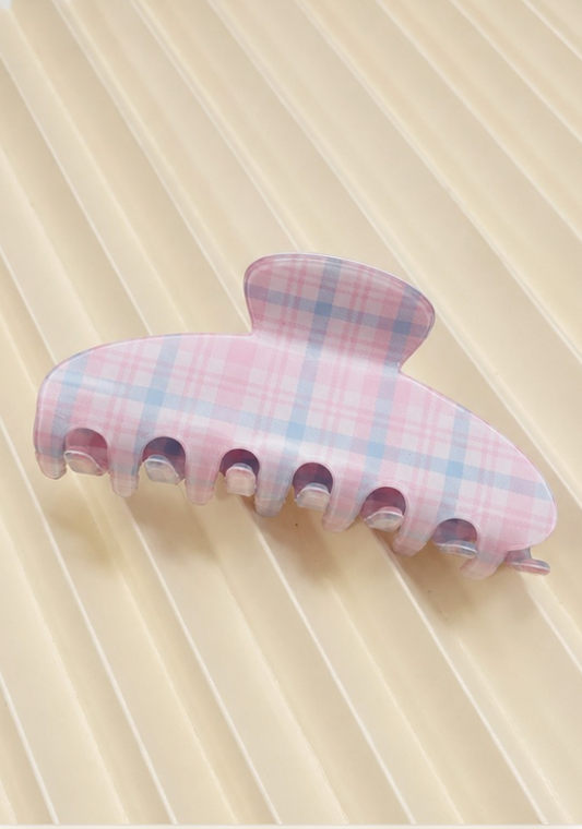 Kelsey Plaid Claw Clip Light Pink featuring a rounded light pink plaid hair claw with interlocking teeth.