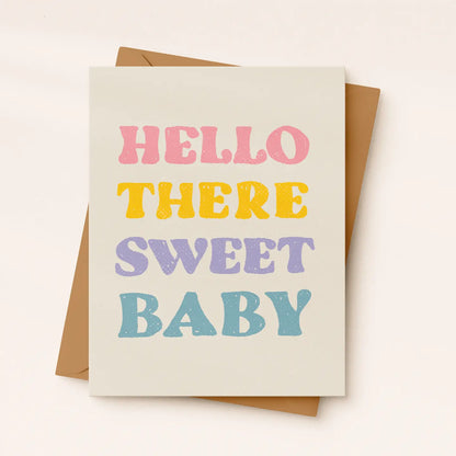 Greeting card with 'Hello there sweet baby' text in pastel colors on a beige background