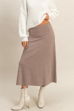 Load image into Gallery viewer, Model wearing Sculpted Ease Knit Skirt in taupe ribbed knit with midi length and clean silhouette