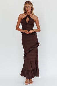 Model wearing Cocoa Ruffle Cutout Dress in chocolate brown with halterneck and ruffle details