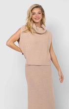 Load image into Gallery viewer, Model wearing cream ribbed oversized turtleneck knit vest paired with matching skirt