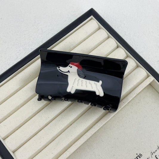 black jumbo hair clip with white dog wearing red beret design