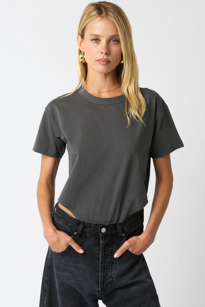Model wearing the Danika Bodysuit in charcoal gray with relaxed round neck and casual fit