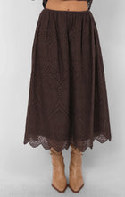 Load image into Gallery viewer, Model wearing brown eyelet midi skirt with scalloped hemline and boots