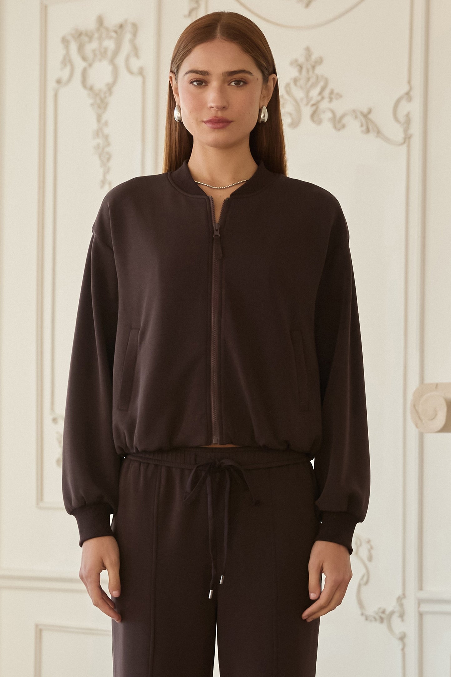 Woman wearing Luxe Lounge Bomber Jacket in dark brown