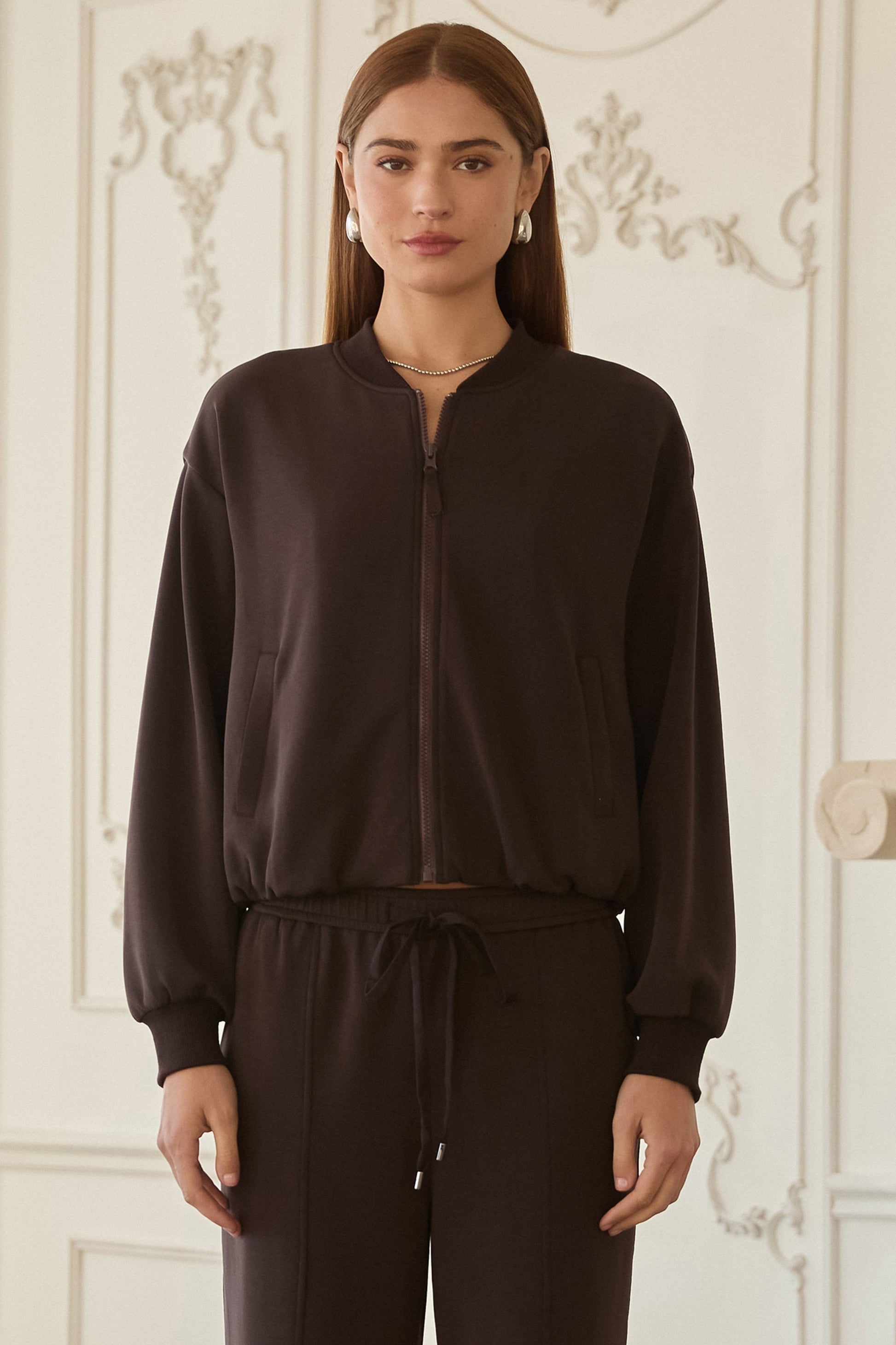 Woman wearing Luxe Lounge Bomber Jacket in dark brown