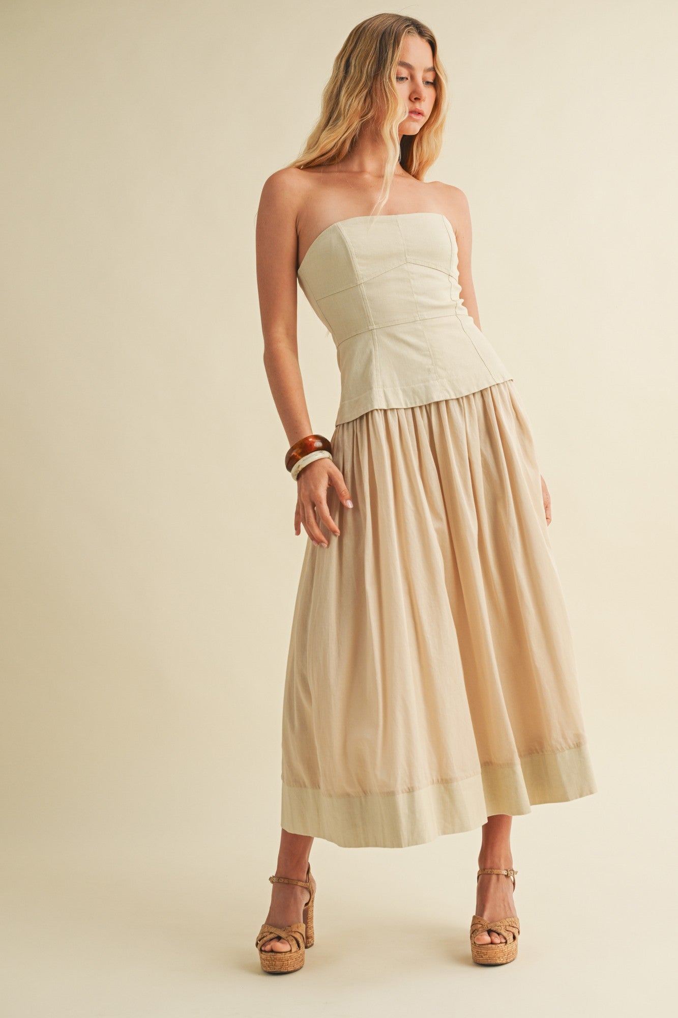 Model wearing Timeless Grace Woven Dress with corset bodice and flowing woven skirt