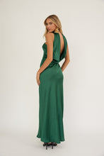 Load image into Gallery viewer, Woman wearing a green evening gown with a plunging neckline on a white background