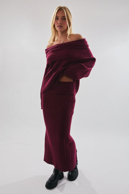 Model wearing Merlot Muse Skirt, ribbed knit low-waisted maxi in merlot with matching sweater