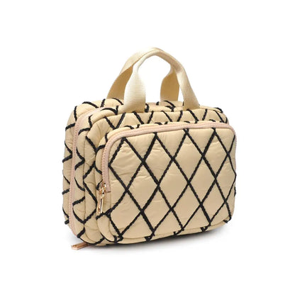 Beige toiletry bag with black geometric pattern on a white background