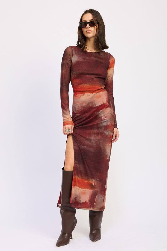 Model wearing Ember Skies Mesh Maxi Dress with abstract rust print, long sleeves, and high slit