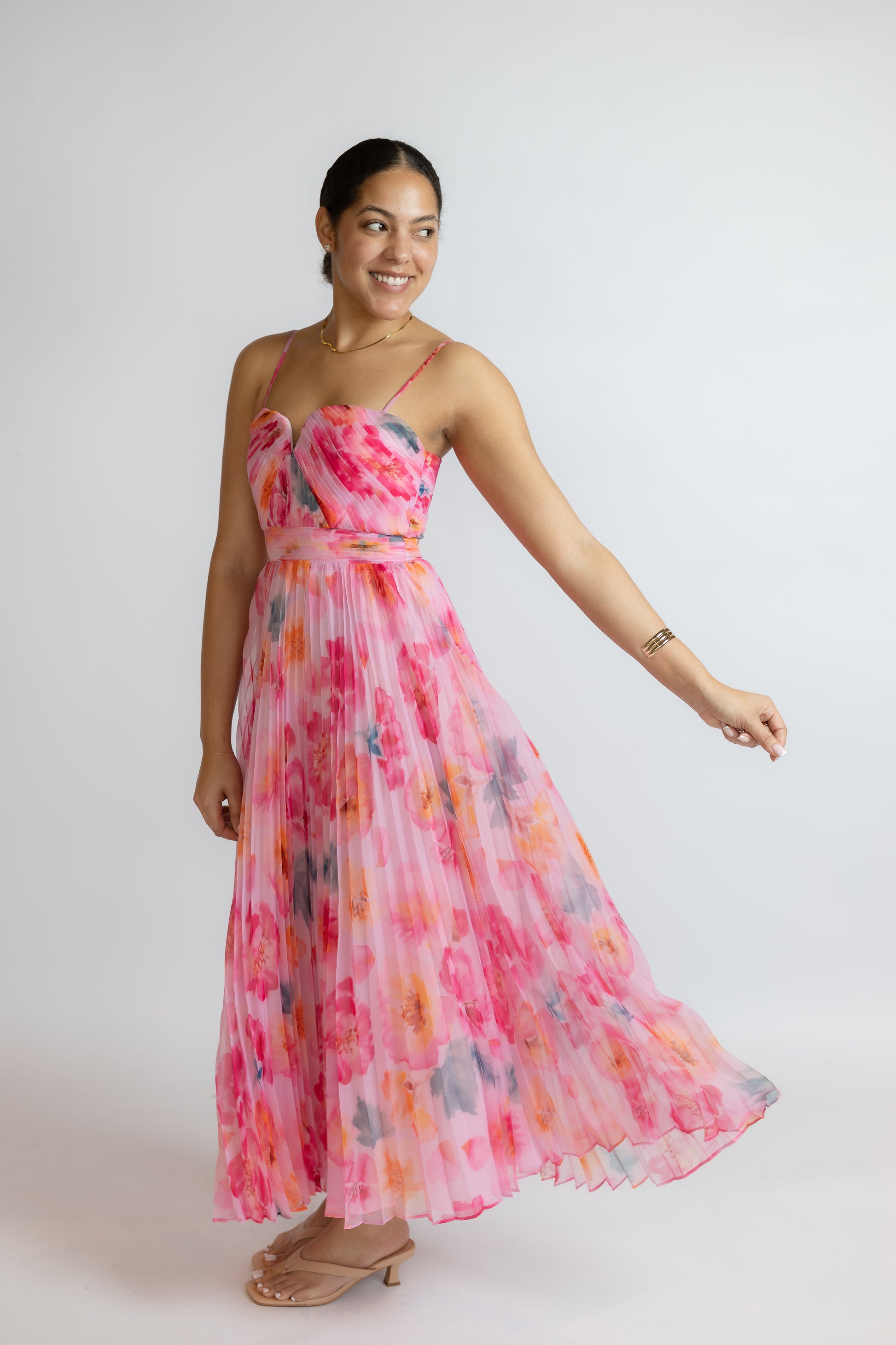 Woman wearing a floral dress on a white background