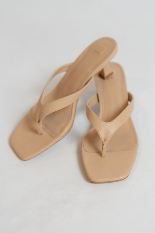 Beige sandals with a square toe on a light gray background
