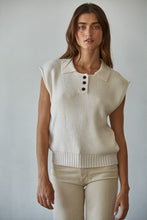 Load image into Gallery viewer, Woman wearing the It’s A Match Polo Vest, a sleeveless ribbed knit polo vest with button-up collar in neutral cream.
