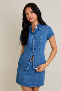 Model wearing Classic Edge Denim Top in blue cotton with button-front design