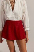 Load image into Gallery viewer, Vegan suede red mini skort with mid-rise fit, side pockets, and shorts lining
