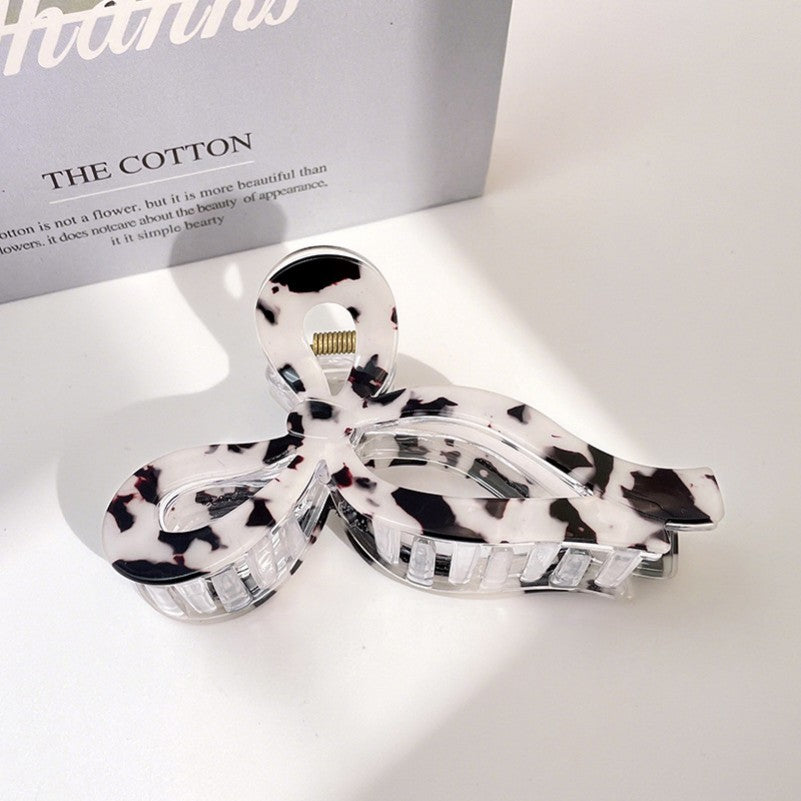 White tortoise acetate bow hair claw clip with jumbo curved shape