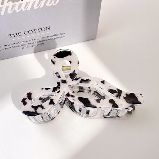 White tortoise acetate bow hair claw clip with jumbo curved shape
